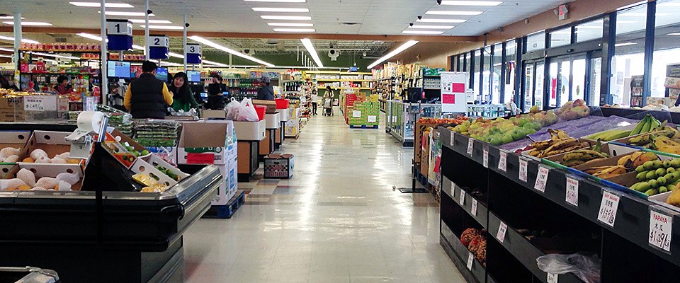 Bright, wide aisles and the produce section inside Viet Hua Food Market